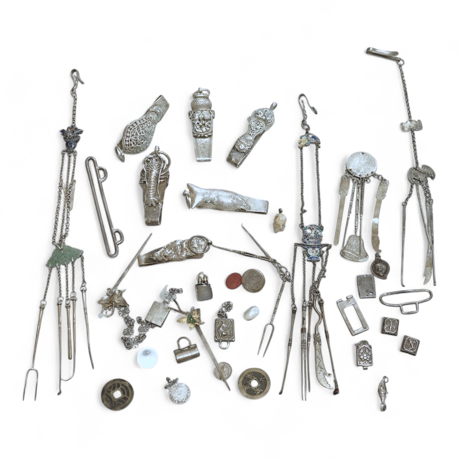 A collection of Chinese Straits white metal hooks, a chatelaine, South East Asian coinage and other items, etc.